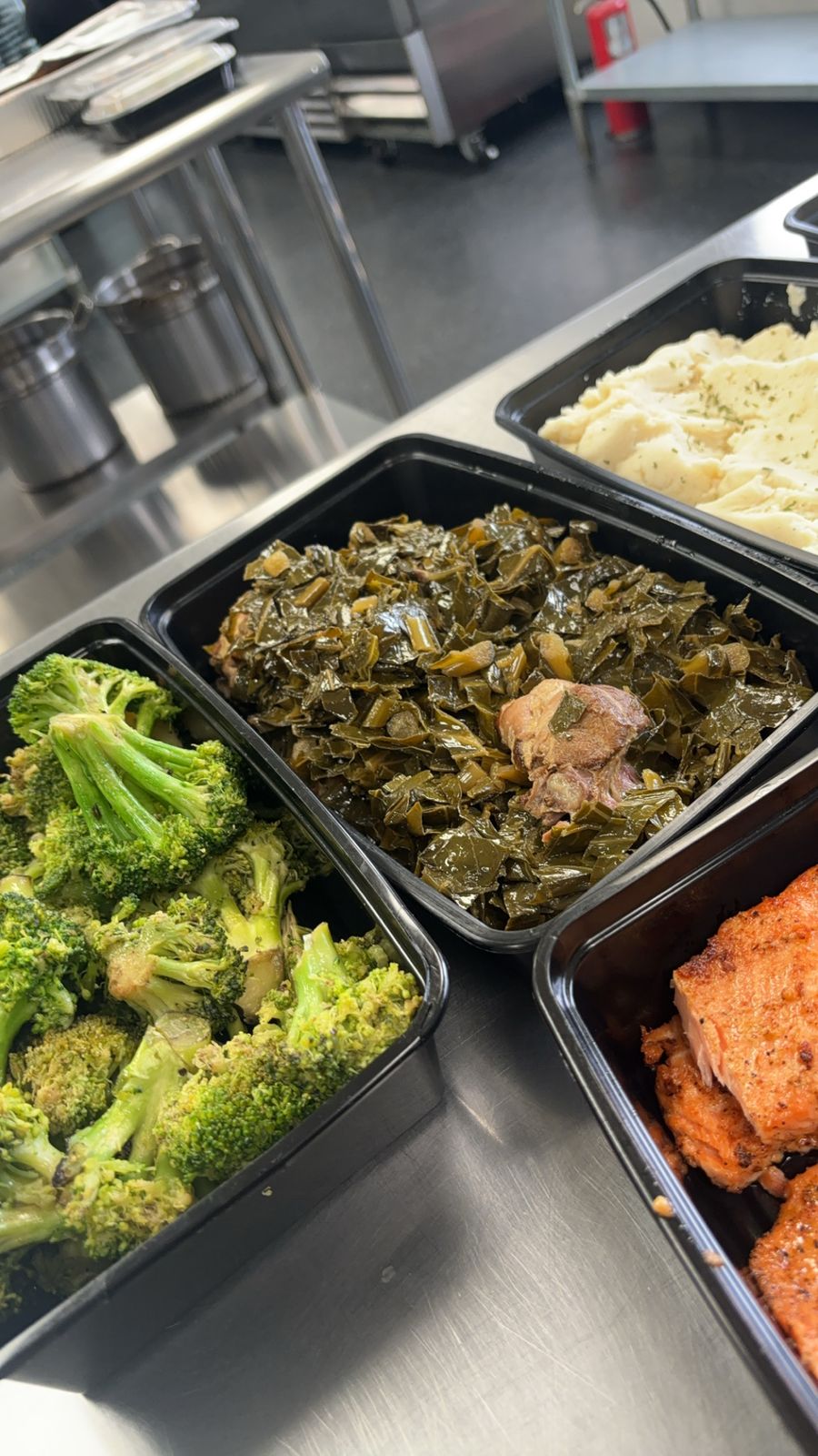 Pans of freshly cooked sides in the commercial kitchen